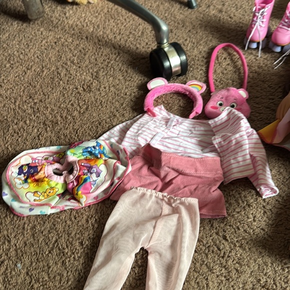 American girl dolls with some clothes and shoes and other items. - Picture 2 of 9